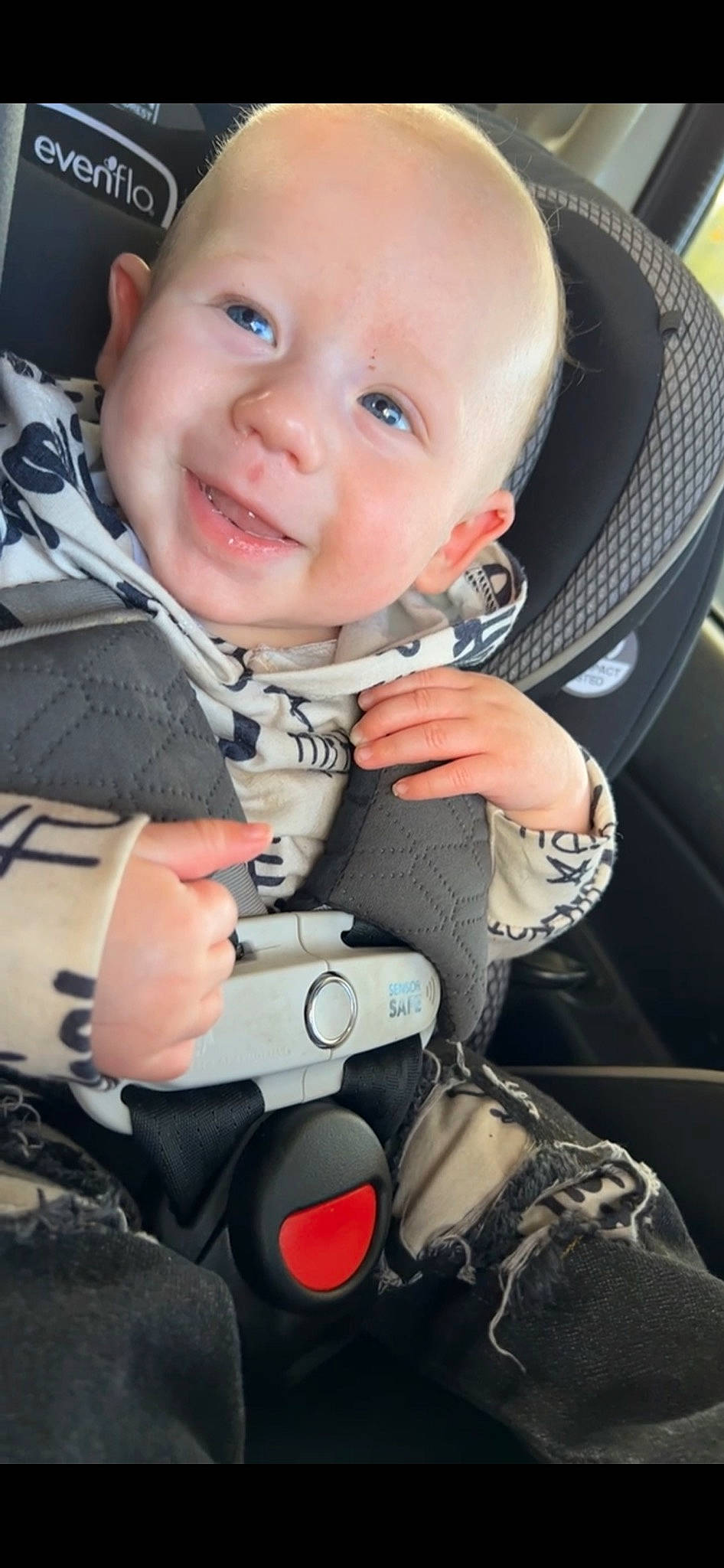 Harlan is registered to the contest to win money with this photo: auto_part, baby, baby_carriage, baby_products, baby_toddler_clothing, car_seat, carmine, child, comfort, electric_blue, finger, flash_photography, happy, joy, nail, person, personal_protective_equipment, product, sitting, smile