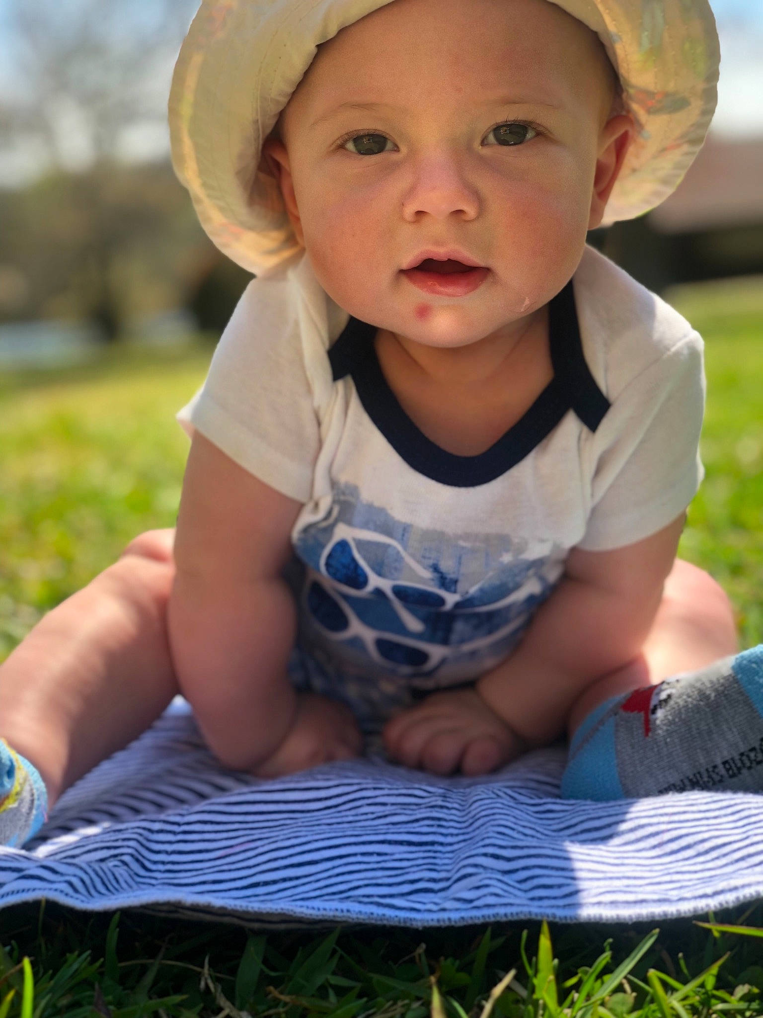 Kase joined the competition — help win amazing prizes! baby, baby_toddler_clothing, cheek, child, fashion_accessory, grass, hat, head, headgear, person, photography, play, sitting, skin, smile, summer, sun_hat, toddler