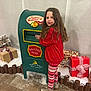 Scarlet is registered to the contest to win money with this photo: child, girl, mailbox, christmas, holiday, presents, gift_wrap, snow, festive_clothing, red_sweater, patterned_leggings, boots, indoor, smiling, long_hair, north_pole, santa, post_office, decorations, holiday_spirit