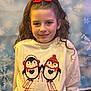 Scarlet is registered to the contest to win money with this photo: child, girl, smile, bow, hair, sweatshirt, penguin, winter, snowflake, background, portrait, clothing, cute, holiday, fun, indoor, fashion, headwear, kid, happy