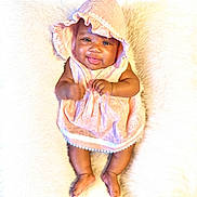 Gianna is registered to the contest to win money with this photo: baby, infant, smiling, pink_dress, bonnet, cute, lying_down, fluffy_blanket, happy, portrait, child, soft_texture, adorable, skin, hands, feet, indoors, young, closeup, person