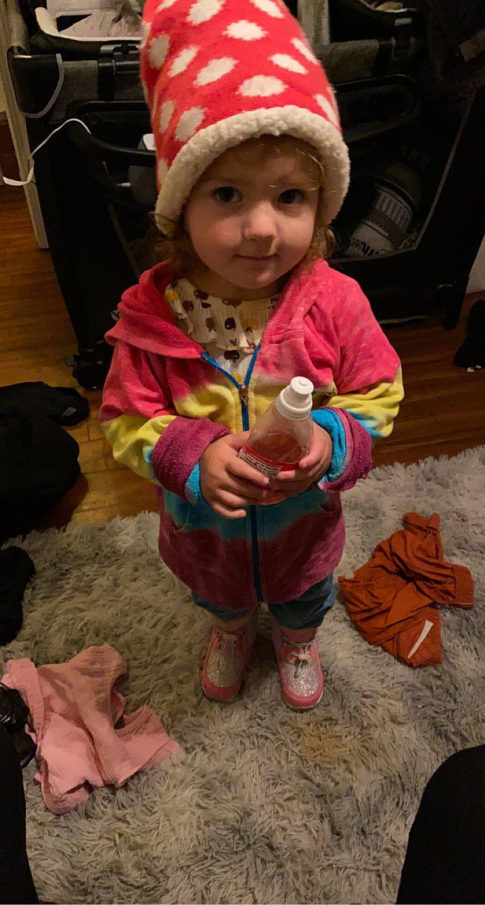 Ivy is registered to the contest to win money with this photo: baby_toddler_clothing, beanie, boot, cap, cheek, child, christmas, eye, fun, head, headwear, holiday, knit_cap, people, person, pink, shoe, skin, smile, toddler