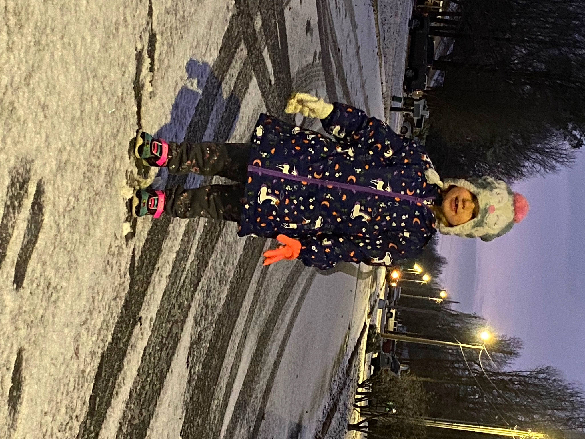 Kenley is registered to the contest to win money with this photo: event, fun, headwear, landscape, night, person, plant, reflection, shadow, sky, space, street_light, travel, tree, water, window, wood, world