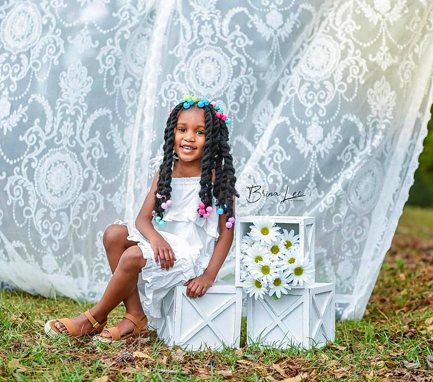 Zoie is registered to the contest to win money with this photo: bridal_clothing, chair, day_dress, dress, event, fashion, flash_photography, formal_wear, fun, grass, happy, headwear, joy, lawn, leisure, meadow, people_in_nature, person, petal, pink