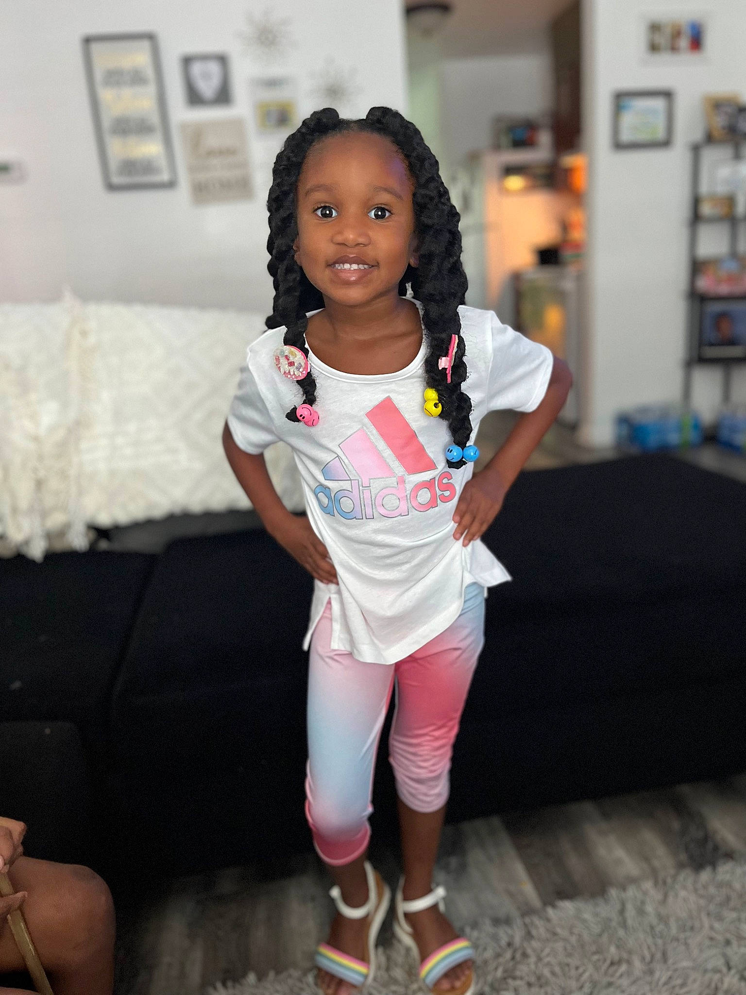 Zoie joined the competition — help win amazing prizes! baby_toddler_clothing, eye, face, fashion_design, flooring, hair, happy, head, joy, knee, leg, leisure, long_hair, person, picture_frame, shoe, sleeve, smile, sneakers, sock