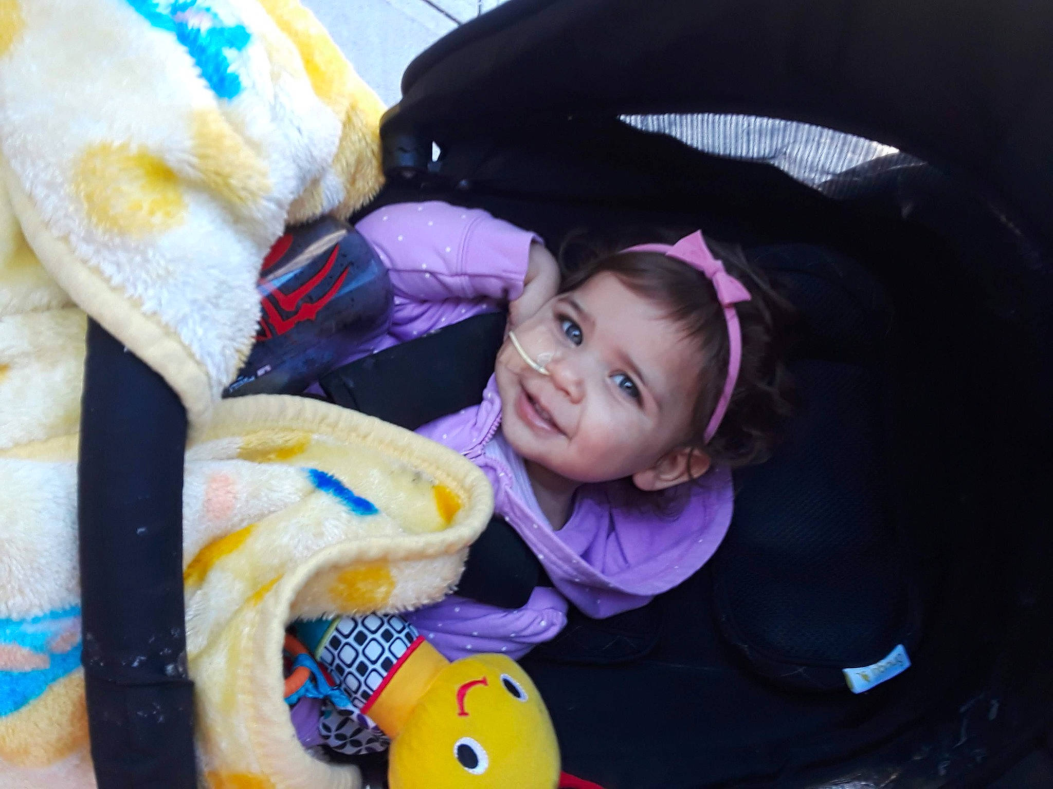 Kaia is registered to the contest to win money with this photo: baby, black_hair, cheek, child, cool, eye, fun, happy, joy, person, photography, purple, skin, smile, toddler, yellow