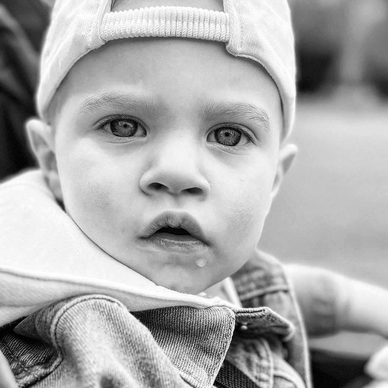 Brayden is registered to the contest to win money with this photo: baby, baseballcap, beanie, bodypart, bonnet, cap, clothing, coat, face, finger, hand, hat, head, hood, jacket, knitwear, person, photography, portrait, sweater