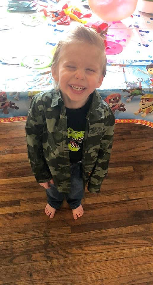 Jaxsyn is registered to the contest to win money with this photo: baby_toddler_clothing, child, chin, eye, face, floor, flooring, fun, hair, hairstyle, happy, hardwood, head, joy, person, skin, sleeve, smile, standing, t_shirt