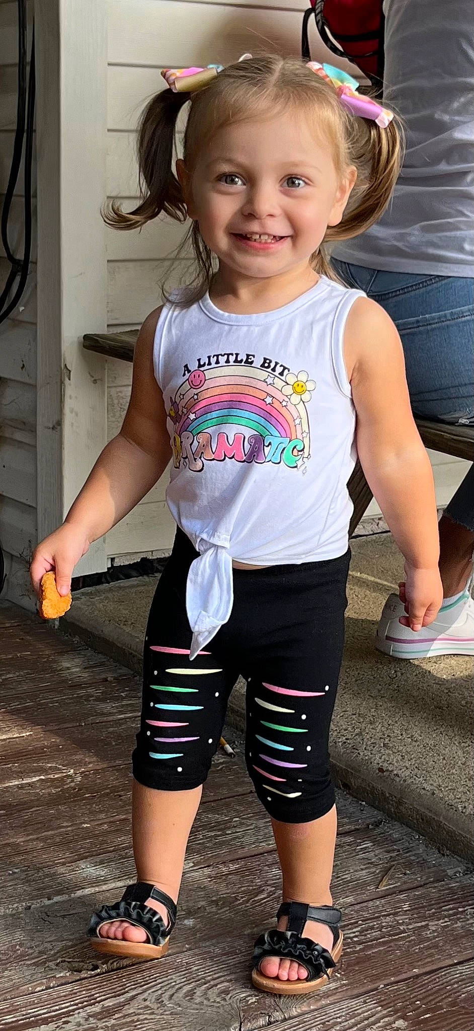 Mckenzie is registered to the contest to win money with this photo: cool, cycling_shorts, electric_blue, fun, happy, head, human_leg, joint, joy, knee, person, shoulder, sleeve, sleeveless_shirt, smile, sportswear, standing, t_shirt, thigh, toddler