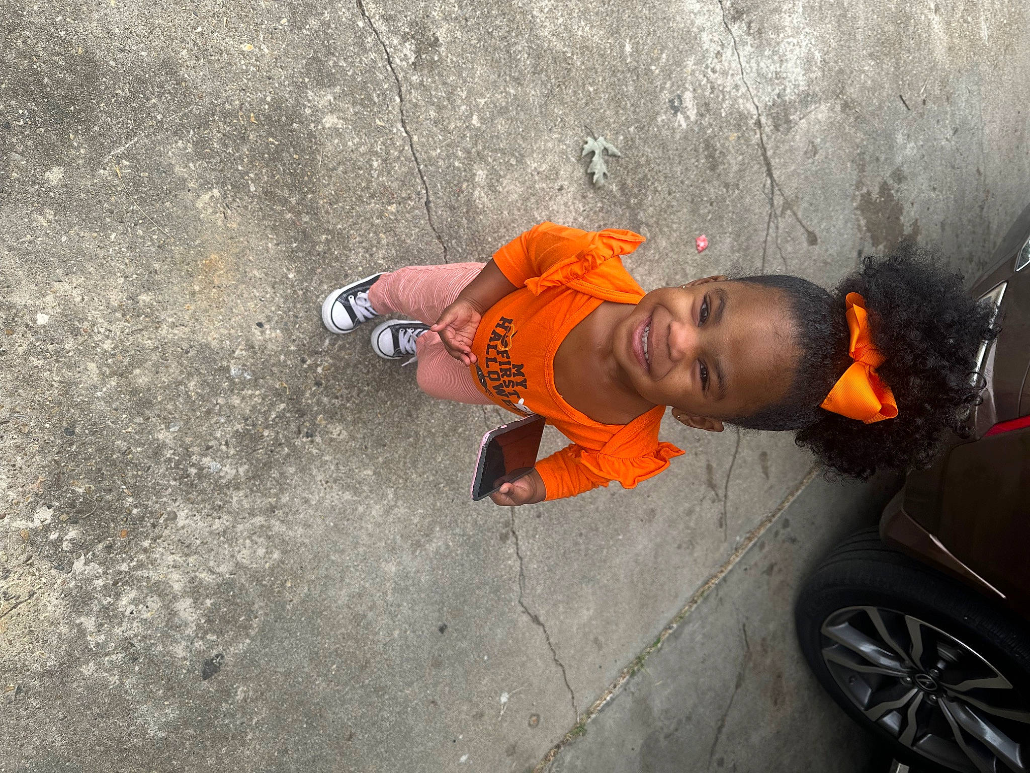 Maliyah is registered to the contest to win money with this photo: asphalt, automotive_design, automotive_exterior, automotive_lighting, automotive_tire, car, child, concrete, fender, joy, motor_vehicle, person, rim, road, road_surface, sidewalk, tints_and_shades, tire, toddler, vehicle