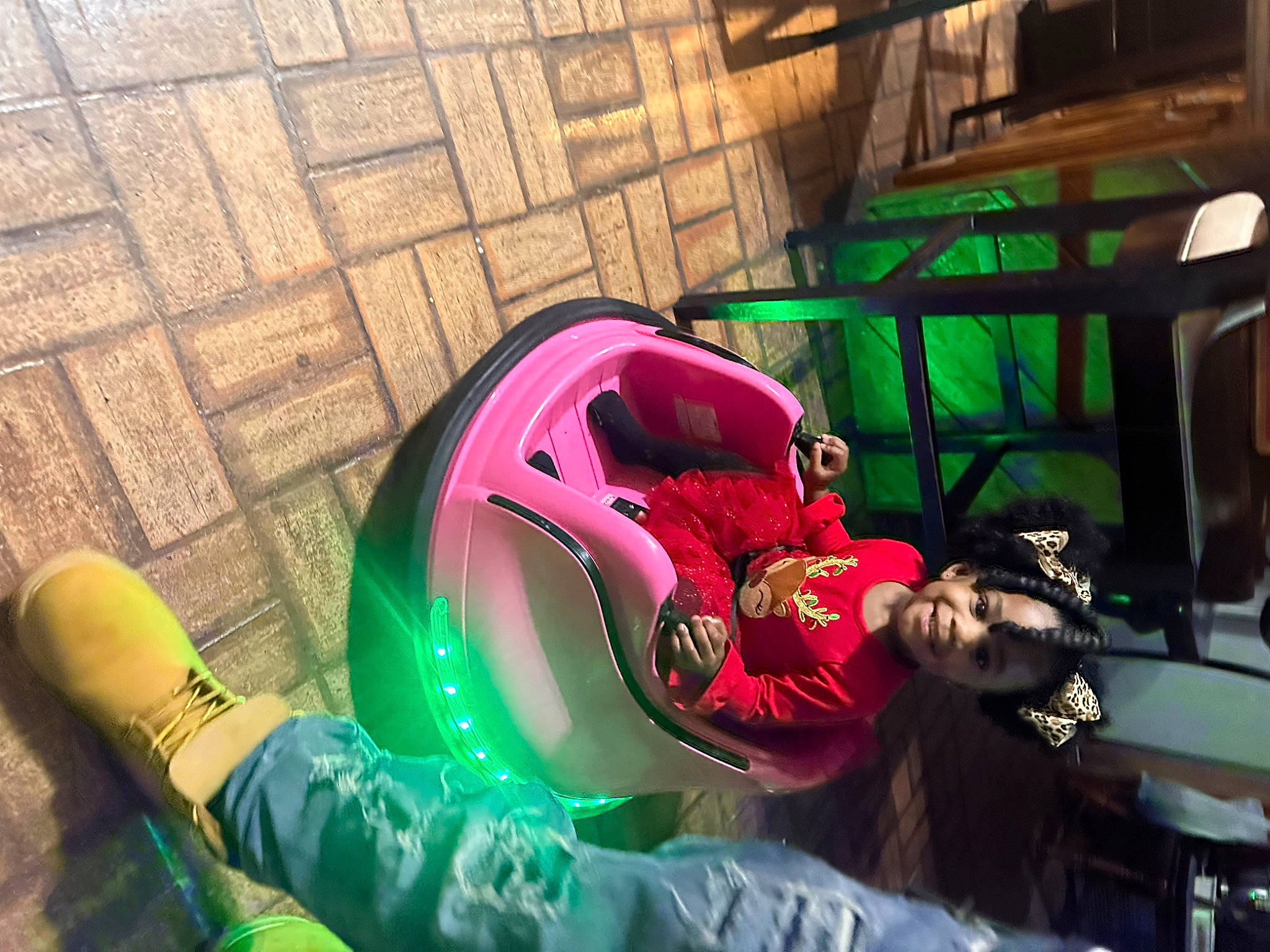 Maliyah is registered to the contest to win money with this photo: auto_part, automotive_design, automotive_exterior, automotive_lighting, automotive_tire, automotive_wheel_system, bumper, fun, games, grass, helmet, human_leg, joy, leisure, machine, magenta, motor_vehicle, person, personal_protective_equipment, recreation