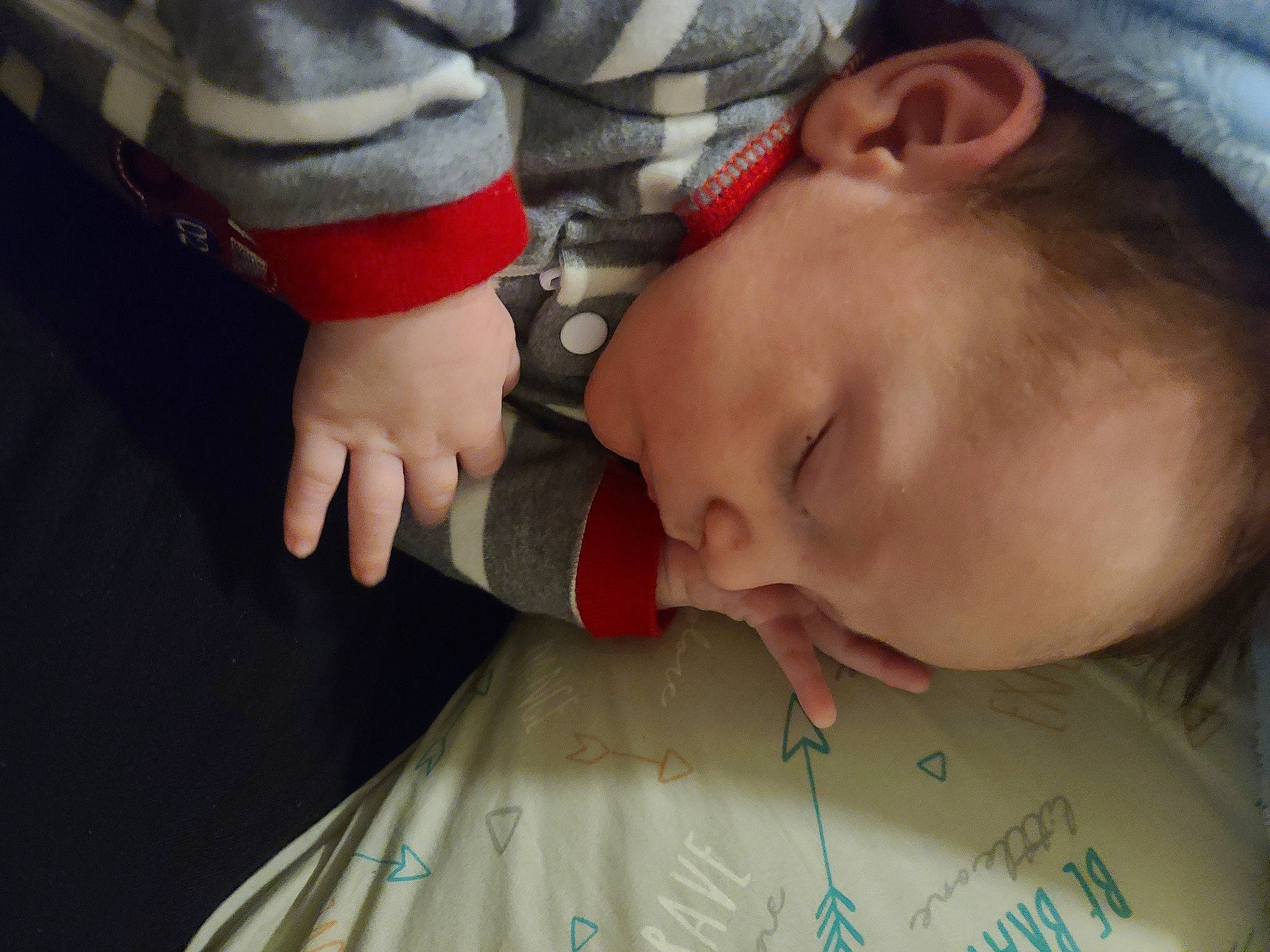 Brandon is registered to the contest to win money with this photo: arm, baby, cheek, chin, ear, eye, eyebrow, eyelash, facial_expression, finger, forehead, gesture, hand, lip, mammal, mouth, neck, nose, person, skin