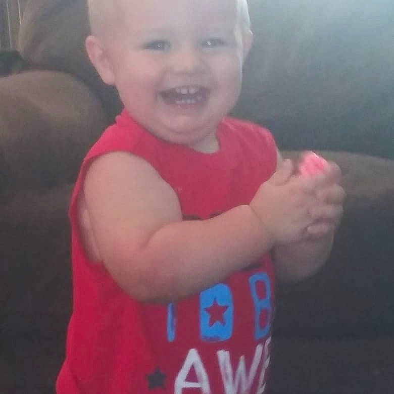 Dustyn is registered to the contest to win money with this photo: arm, baby, cheek, child, chin, cloud, cool, eye, face, facial_expression, finger, head, joint, joy, muscle, nose, person, skin, smile, standing