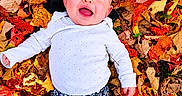 Raven Eclipse joined the competition — help win amazing prizes! autumn, baby, blue_eyes, child, colorful, fall, happy, infant, leaves, lying_down, nature, open_mouth, outdoors, patterned_pants, photography, portrait, seasonal, smiling, top_view, white_shirt