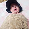 Raven Eclipse joined the competition — help win amazing prizes! baby, bed, bedding, black_hat, blanket, child, cozy, eyes, face, fluffy_blanket, indoor, infant, lying_down, open_mouth, photograph, pink, portrait, surprised, wide_eyed, wooden_floor