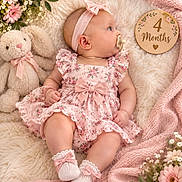 Raven Eclipse joined the competition — help win amazing prizes! baby, infant, child, portrait, lying_down, pink_dress, floral_dress, headband, bow, pacifier, teddy_bear, stuffed_animal, flowers, blanket, furry_blanket, milestone, four_months, socks, nursery, cozy