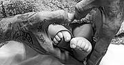 Raven Eclipse joined the competition — help win amazing prizes! adult_hands, baby, black_and_white, blanket, close_up, cozy, family, feet, foot, hands, indoors, infant, monochrome, newborn, parenting, portrait, soft_lighting, swaddled, tattoo, toes