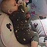 Raven Eclipse is registered to the contest to win money with this photo: baby, bed, bedding, blanket, cartoon, child, cozy, cute, indoors, infant, lying_down, minnie_mouse, onesie, pillow, plush, portrait, resting, side_profile, sleepwear, socks
