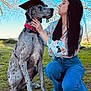 Achilles is registered to the contest to win money with this photo: dog, woman, grass, blue_sky, graduation_cap, outdoor, trees, kneeling, affection, casual_clothing, spotting, collar, pets, celebration, nature, portrait, daylight, happy, friendship, animal
