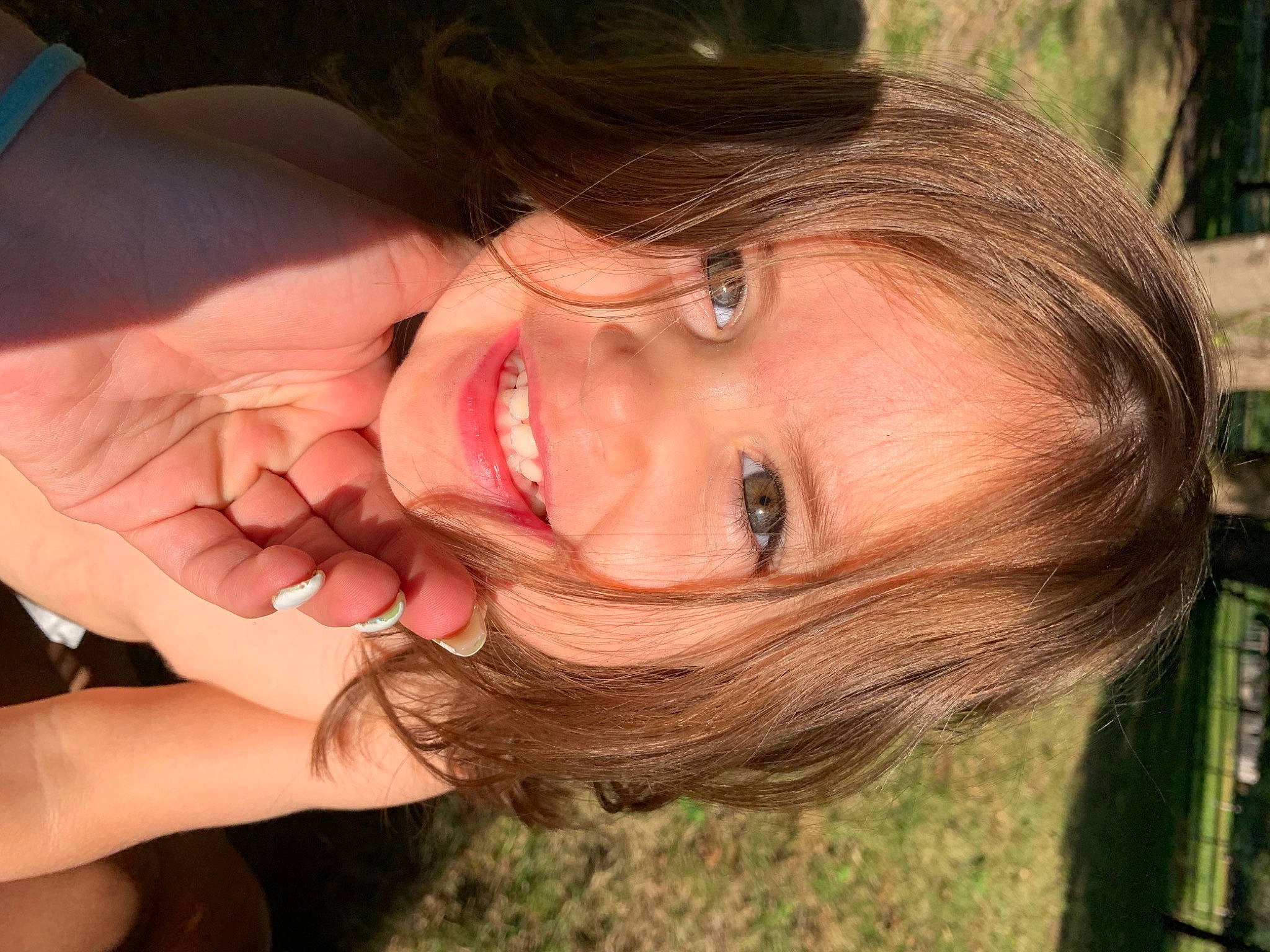 Inaya participe au concours pour gagner de l'argent avec cette photo : chin, dress, eyebrow, eyelash, face, facial_expression, gesture, grass, hairstyle, happy, jaw, joy, lip, mammal, mouth, neck, nose, people_in_nature, person, plant