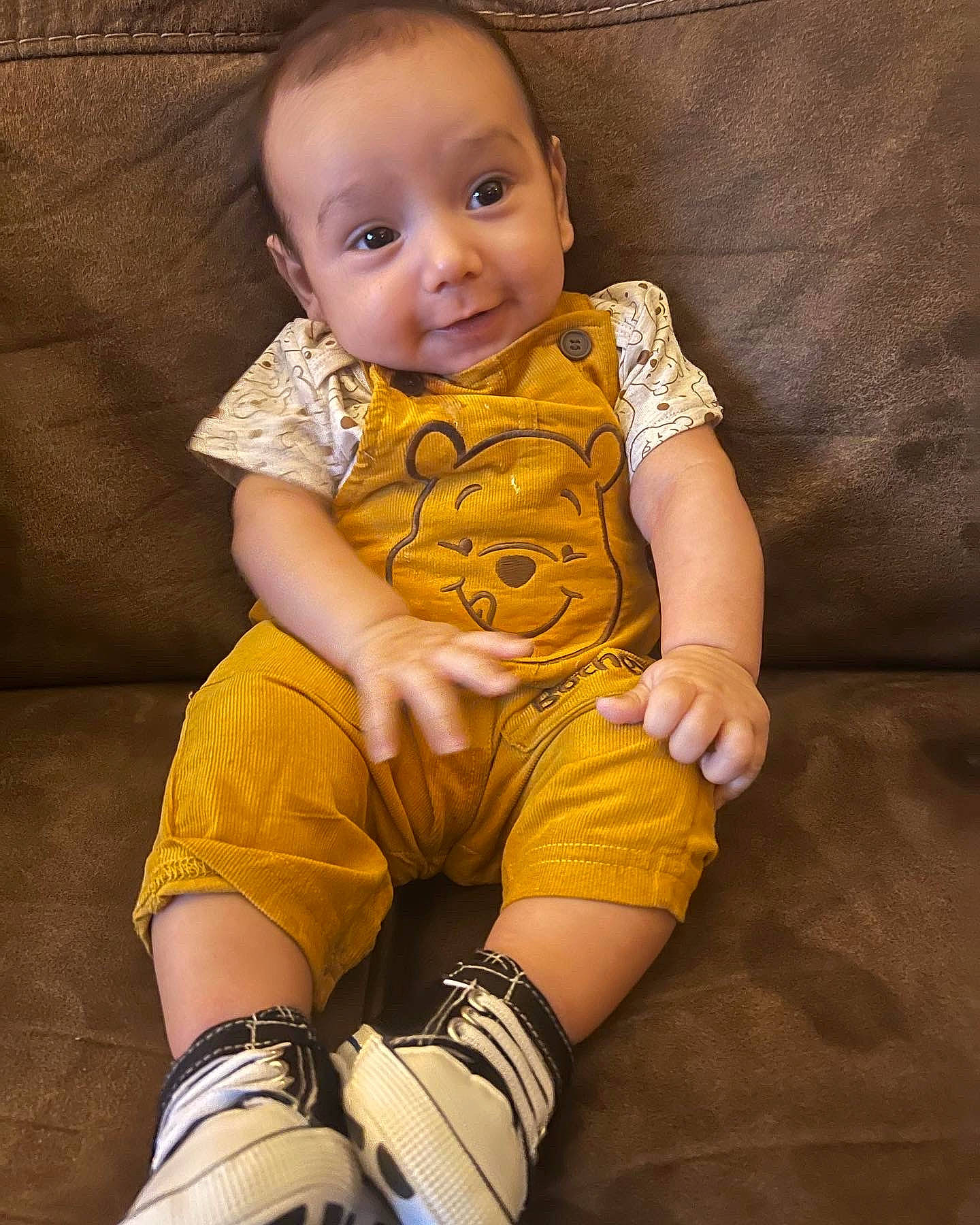 Aiden joined the competition — help win amazing prizes! baby, baby_toddler_clothing, cheek, elbow, eye, face, finger, hand, human_body, human_leg, knee, leg, neck, pattern, person, sitting, skin, sleeve, t_shirt, thigh