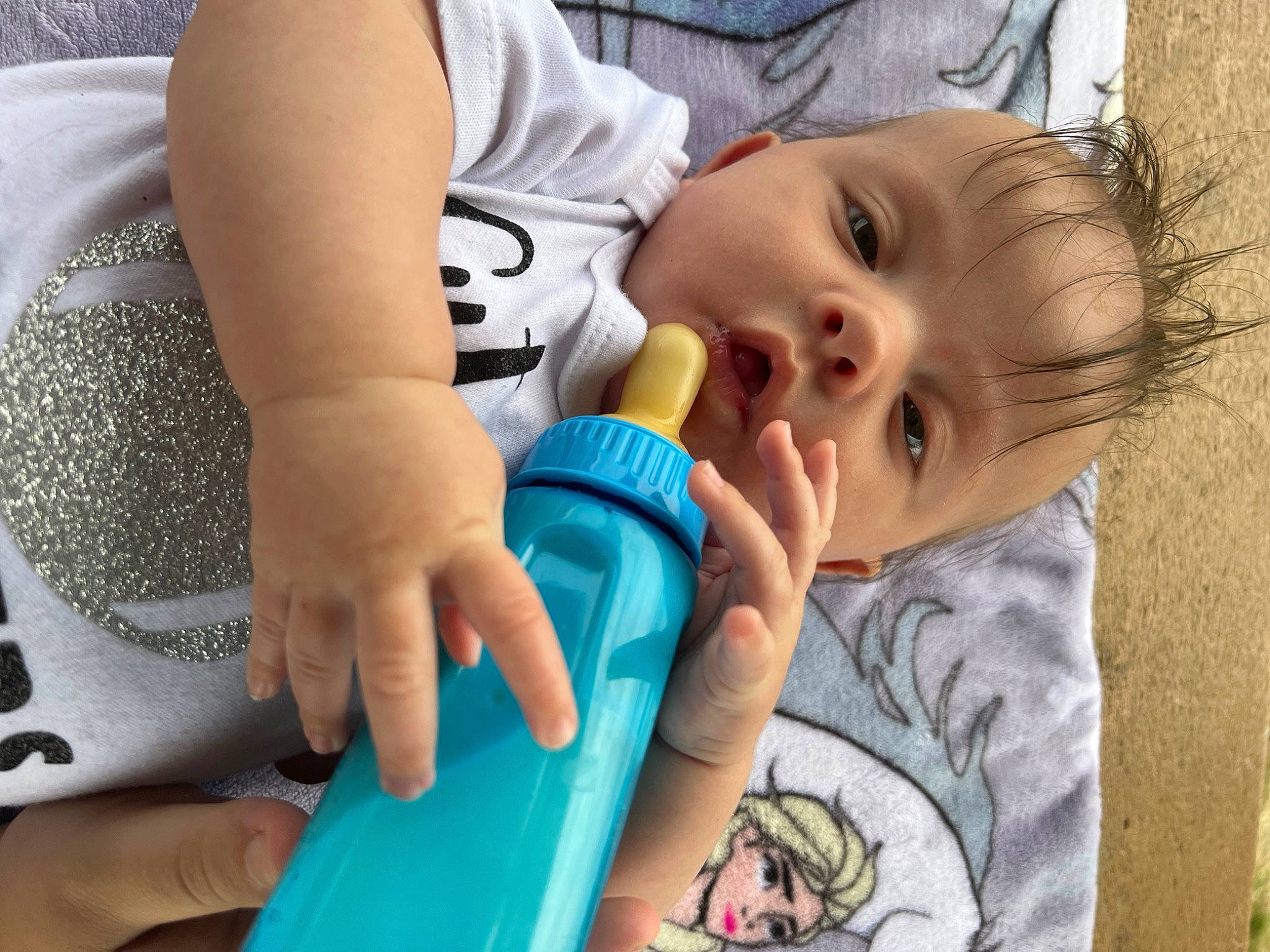 Delilah joined the competition — help win amazing prizes! baby, baby_products, baby_toddler_clothing, child, eyelash, finger, fun, gesture, grass, happy, leisure, mouth, nail, nose, person, plastic_bottle, play, skin, thumb, toddler