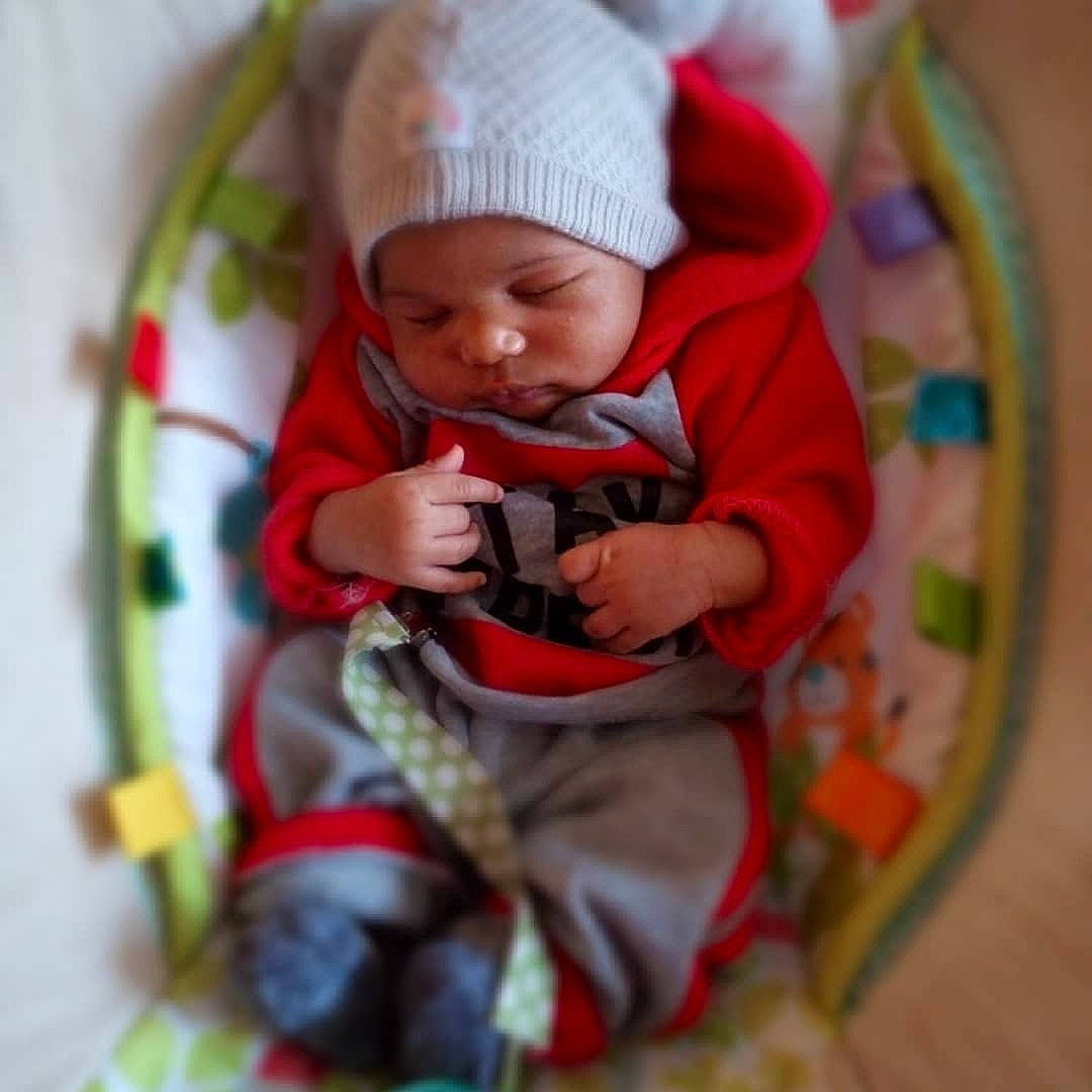 Dominique is registered to the contest to win money with this photo: baby, baby_products, baby_toys, child, headwear, person, play, product, skin, smile, toddler, toy