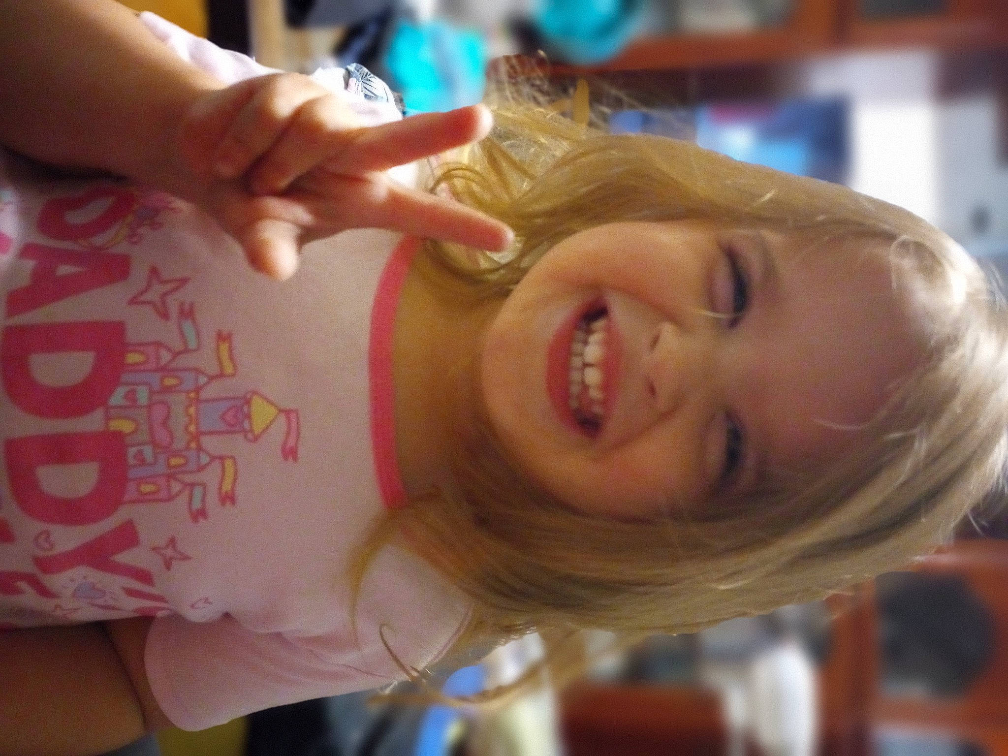 Bridget is registered to the contest to win money with this photo: arm, black_hair, cheek, child, ear, eyelash, facial_expression, finger, food, forehead, hand, happy, human, joy, lip, mouth, neck, nose, people, person