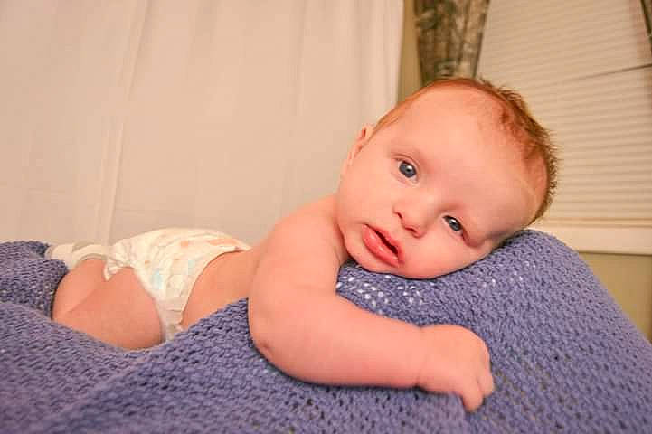 Konner joined the competition — help win amazing prizes! baby, baby_sleeping, baby_toddler_clothing, cheek, child, comfort, flash_photography, flooring, hardwood, human_leg, iris, linens, pattern, person, portrait_photography, room, sitting, skin, stomach, toddler