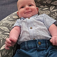 Jayce joined the competition — help win amazing prizes! baby, casual_wear, child, clothing, cushion, cute, denim_shorts, face, happy, home, indoors, infant, person, portrait, relaxed, seated, smiling, soft_fabric, striped_shirt, young