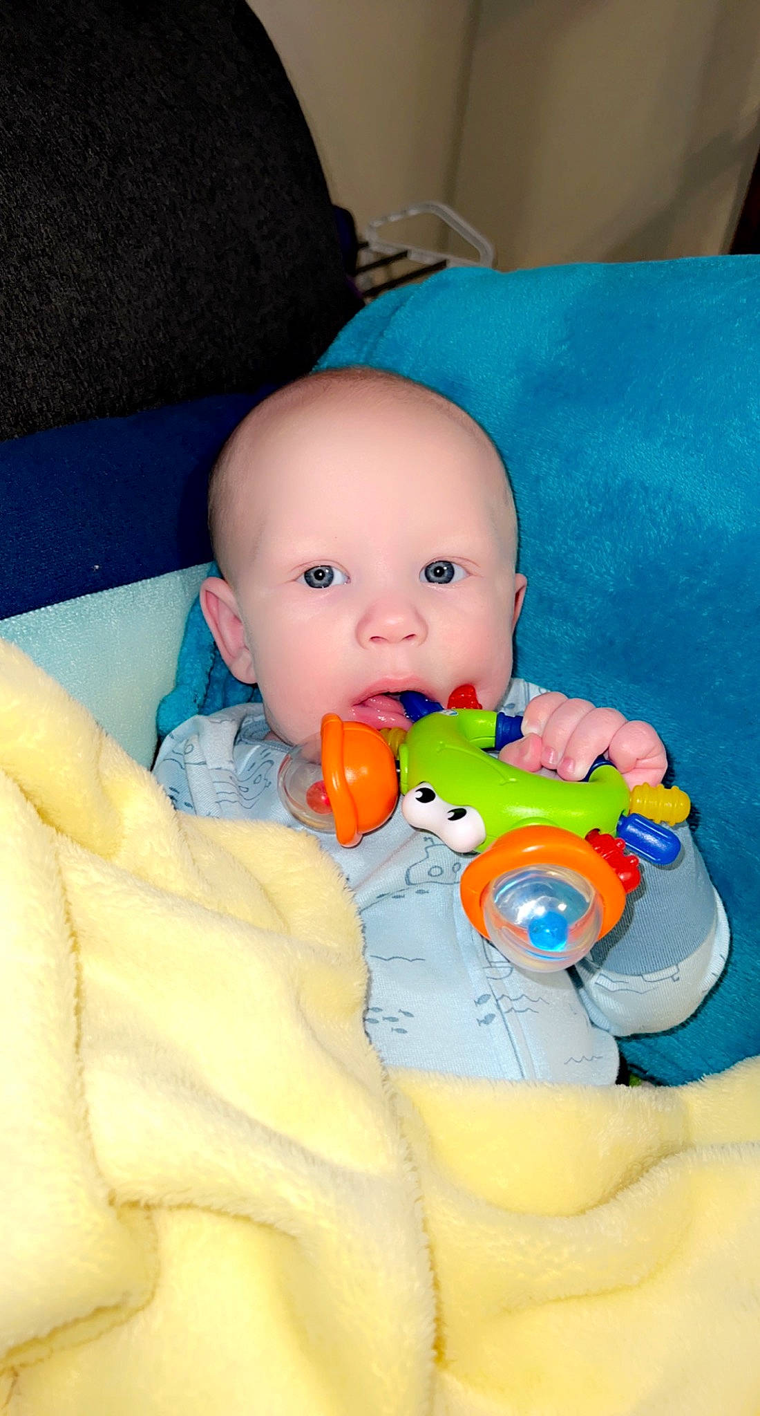 Gunnar is registered to the contest to win money with this photo: arm, baby, baby_products, baby_toys, bathtub, cheek, child, comfort, eye, figurine, finger, head, joint, mouth, person, plastic, product, skin, stuffed_toy, toddler