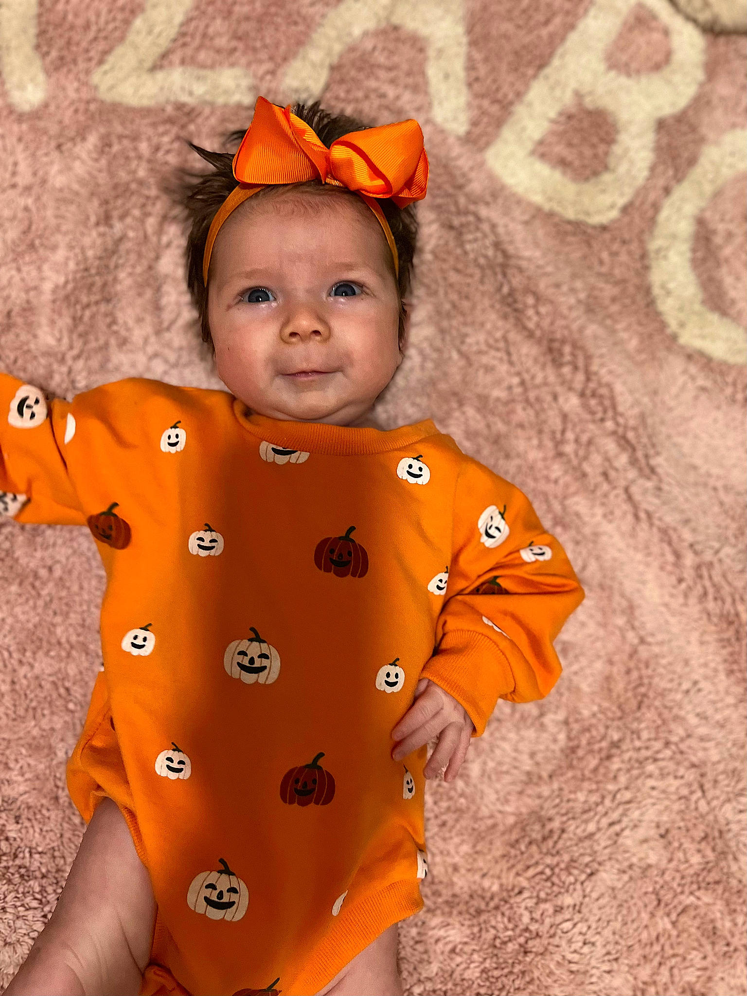 Joy is registered to the contest to win money with this photo: baby, baby_products, baby_toddler_clothing, cheek, child, costume_hat, eye, face, fun, happy, head, headwear, human_body, orange, outerwear, pattern, peach, person, skin, sleeve