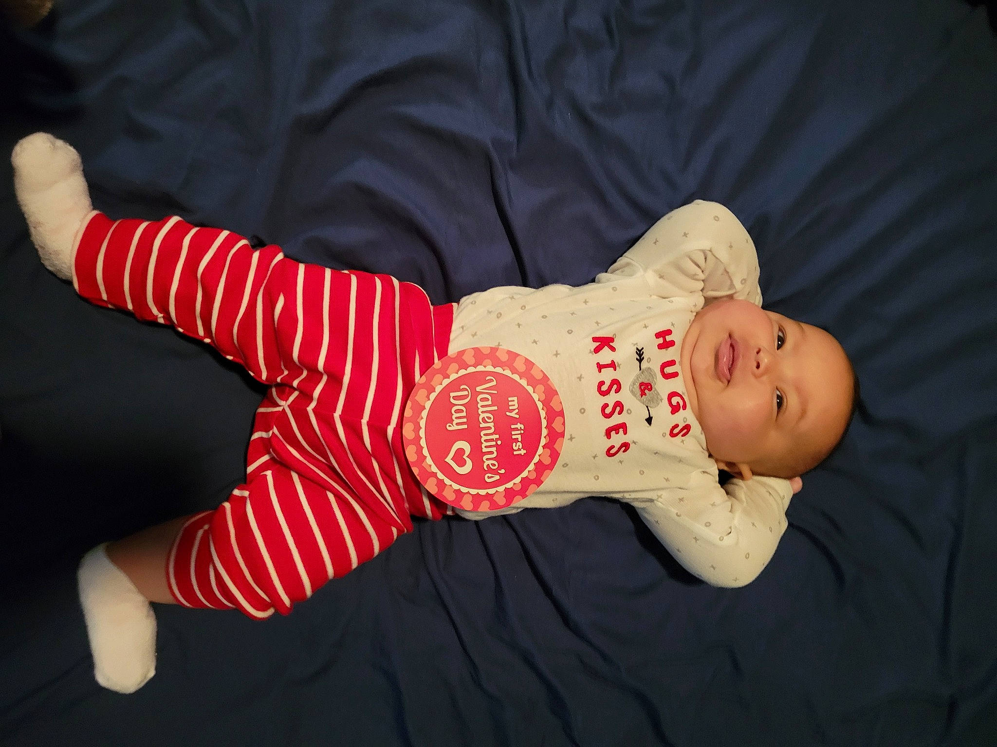 Ayla is registered to the contest to win money with this photo: abdomen, baby_toddler_clothing, carmine, child, elbow, finger, font, foot, gesture, happy, human_leg, knee, leg, nail, pattern, person, sleeve, thigh, thumb, toddler
