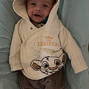Owen participe au concours pour gagner de l'argent avec cette photo : baby, child, hoodie, lion_king, disney, smiling, pacifier, cushion, clothing, pants, socks, infant, cute, portrait, soft_toys, indoor, cozy, headwear, fabric, comfort