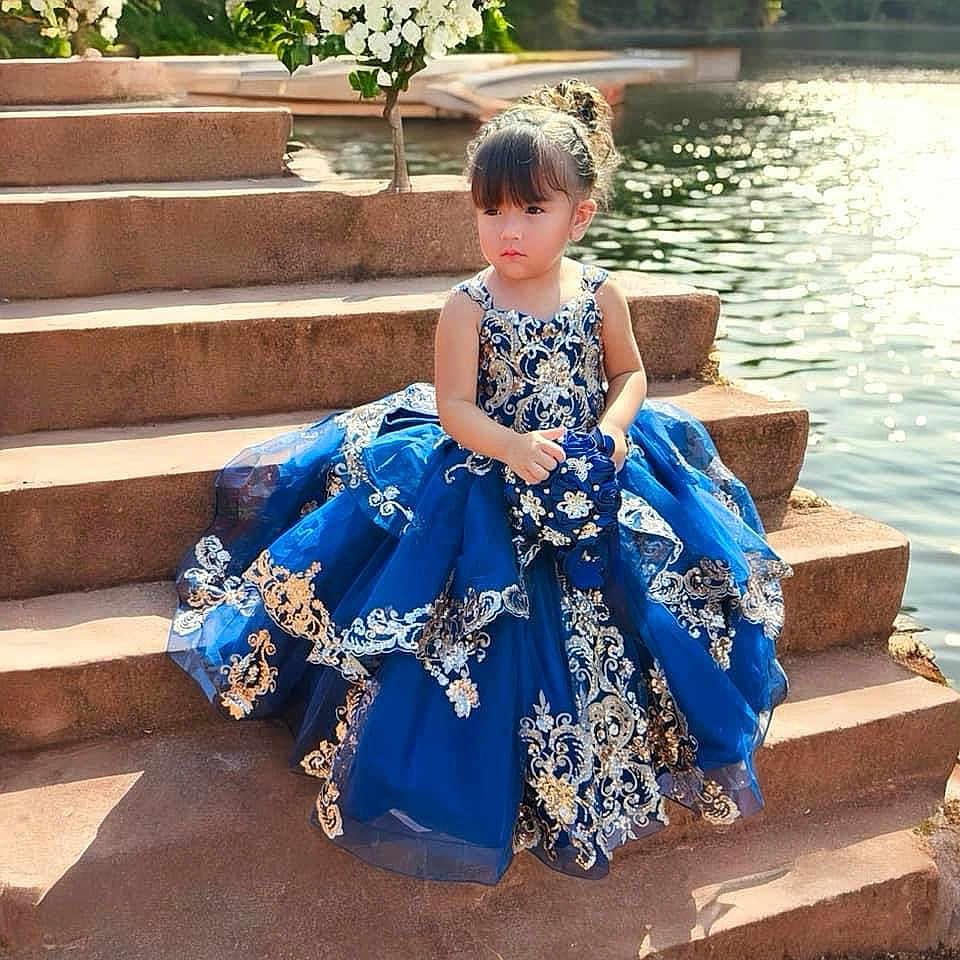 Melanie joined the competition — help win amazing prizes! blackhair, child, clothing, dress, eveningdress, face, fashion, female, formalwear, girl, gown, hair, head, person, photography, portrait, sitting, sleeve, wedding, weddinggown