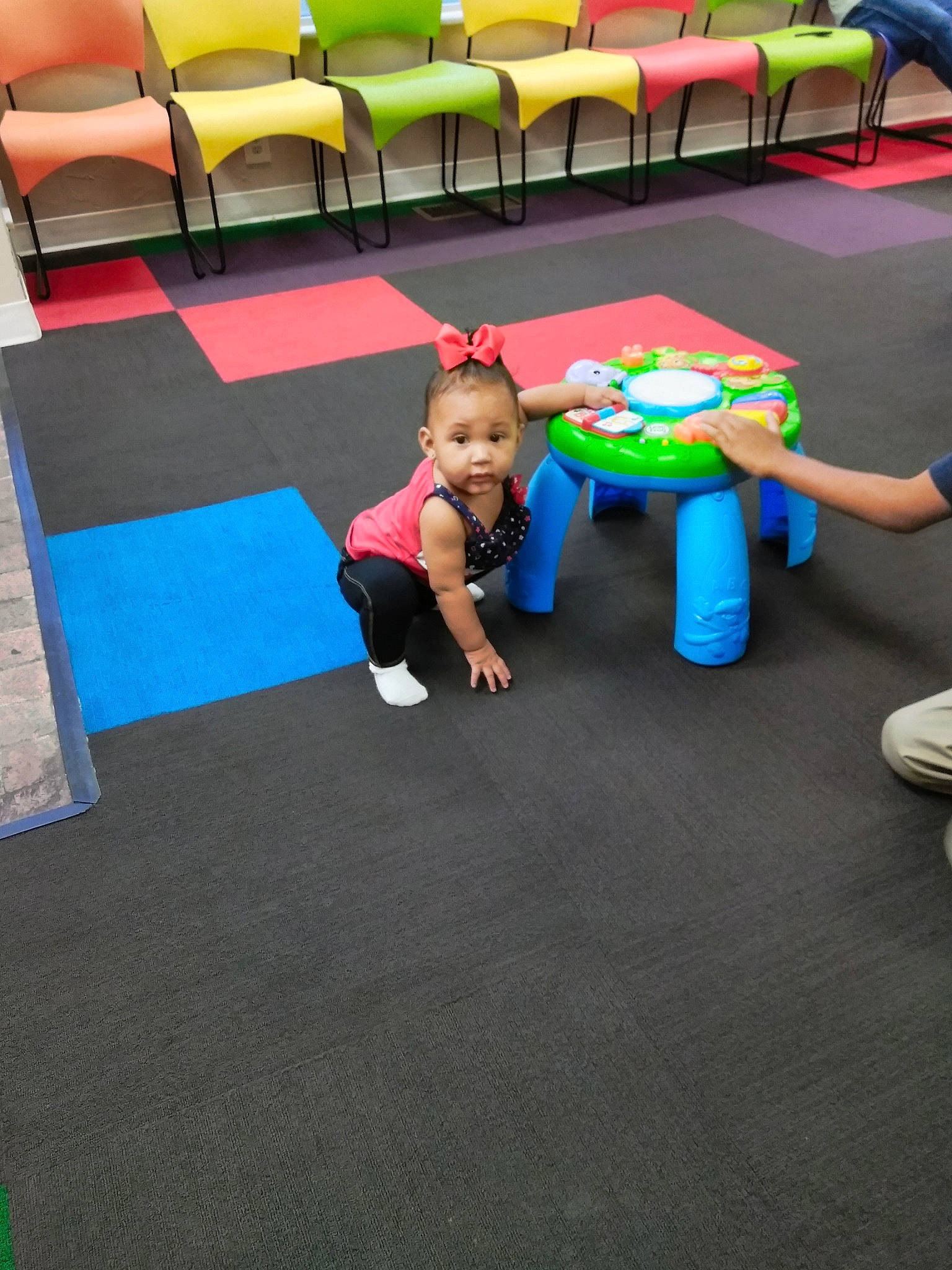 Chasity is registered to the contest to win money with this photo: carpet, child, day, floor, flooring, fun, hardwood, indoor_games_and_sports, leisure, mat, person, physical_fitness, play, playground, product, room, sport_venue, table, toddler, wood_flooring