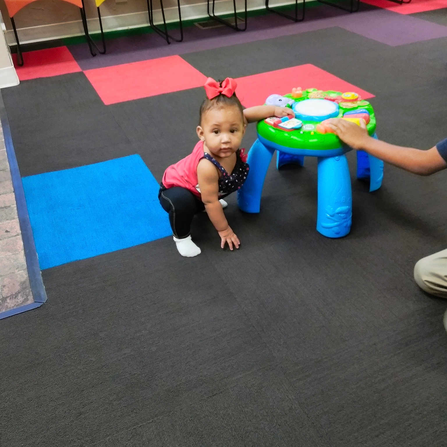 Chasity is registered to the contest to win money with this photo: carpet, child, day, floor, flooring, fun, hardwood, indoor_games_and_sports, leisure, mat, person, physical_fitness, play, playground, product, room, sport_venue, table, toddler, wood_flooring