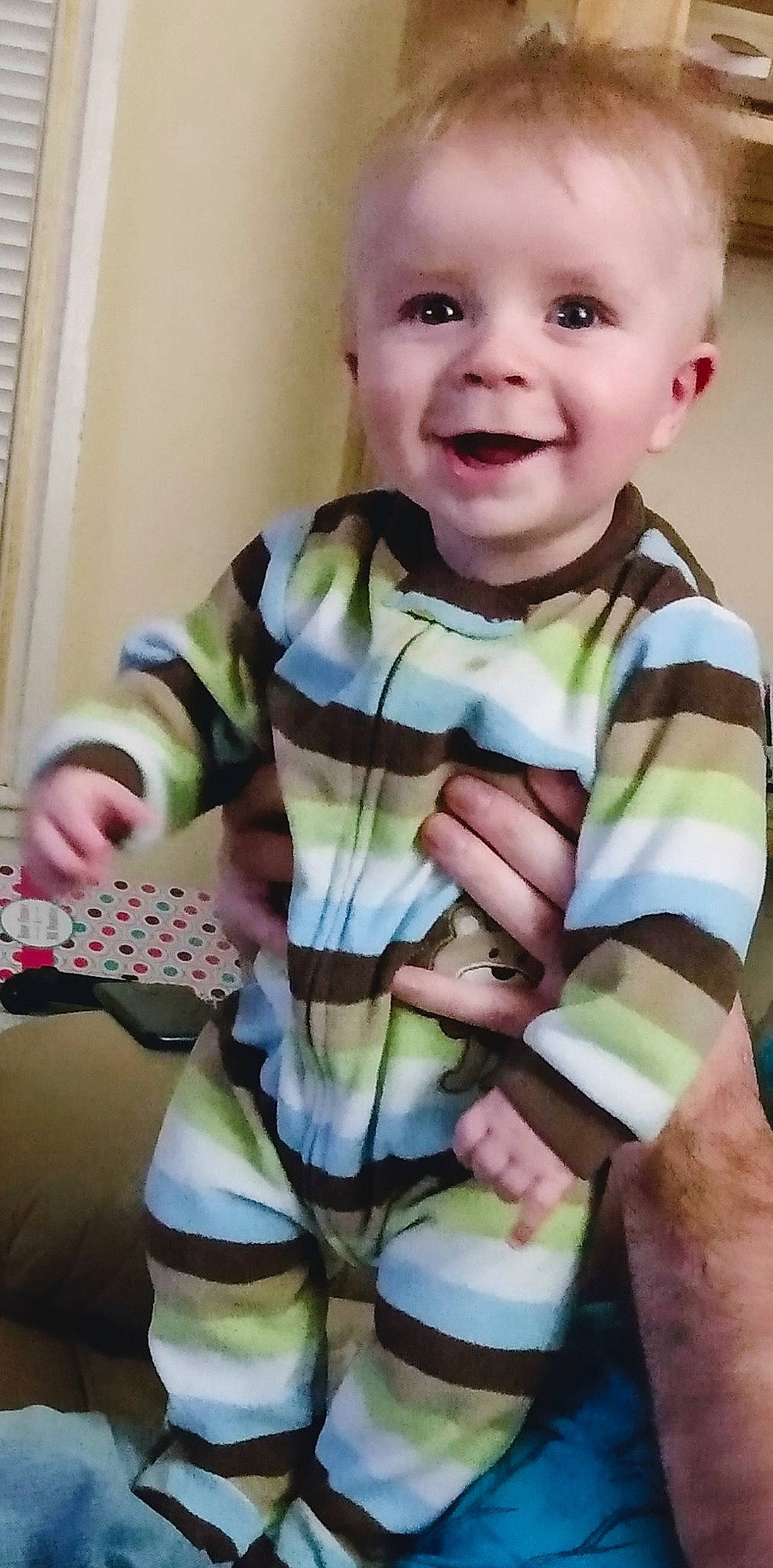 Gabe is registered to the contest to win money with this photo: baby, baby_products, baby_toddler_clothing, cheek, child, facial_expression, joy, person, play, smile, toddler