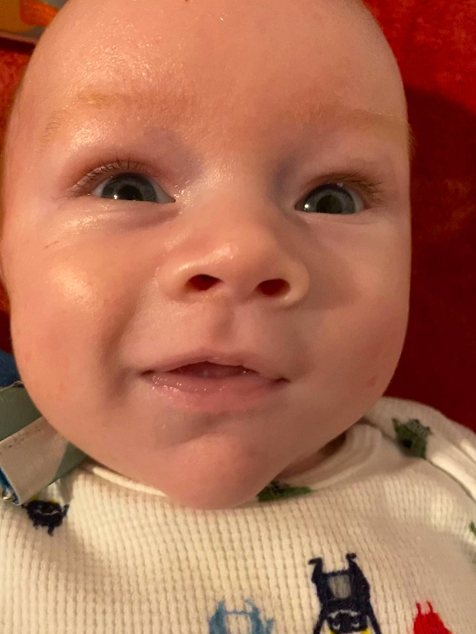 Calum is registered to the contest to win money with this photo: baby, baby_toddler_clothing, cheek, child, chin, close_up, eyebrow, eyelash, facial_expression, forehead, happy, iris, jaw, laugh, lip, mouth, nose, organ, person, skin