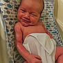 Koehn joined the competition — help win amazing prizes! baby, newborn, towel, bath, bath_seat, fish_pattern, smile, infant, skin, arm, hand, head, face, lying_down, cute, child, indoors, closeup, person, resting