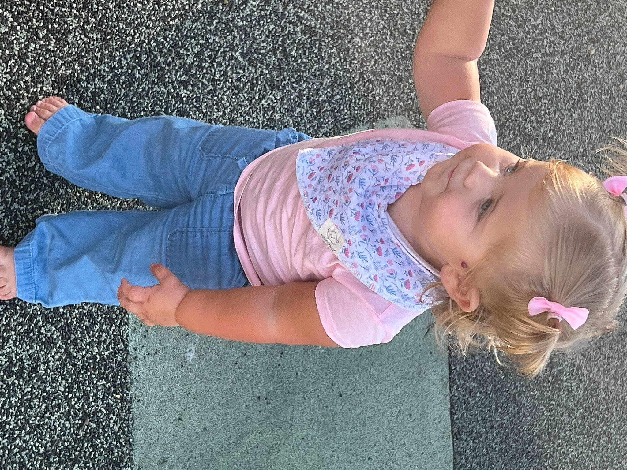 Charleigh is registered to the contest to win money with this photo: arm, denim, eyewear, fashion, fun, grass, happy, human_body, human_leg, joint, knee, leg, leisure, person, pink, plant, sunglasses, textile, thigh, toddler