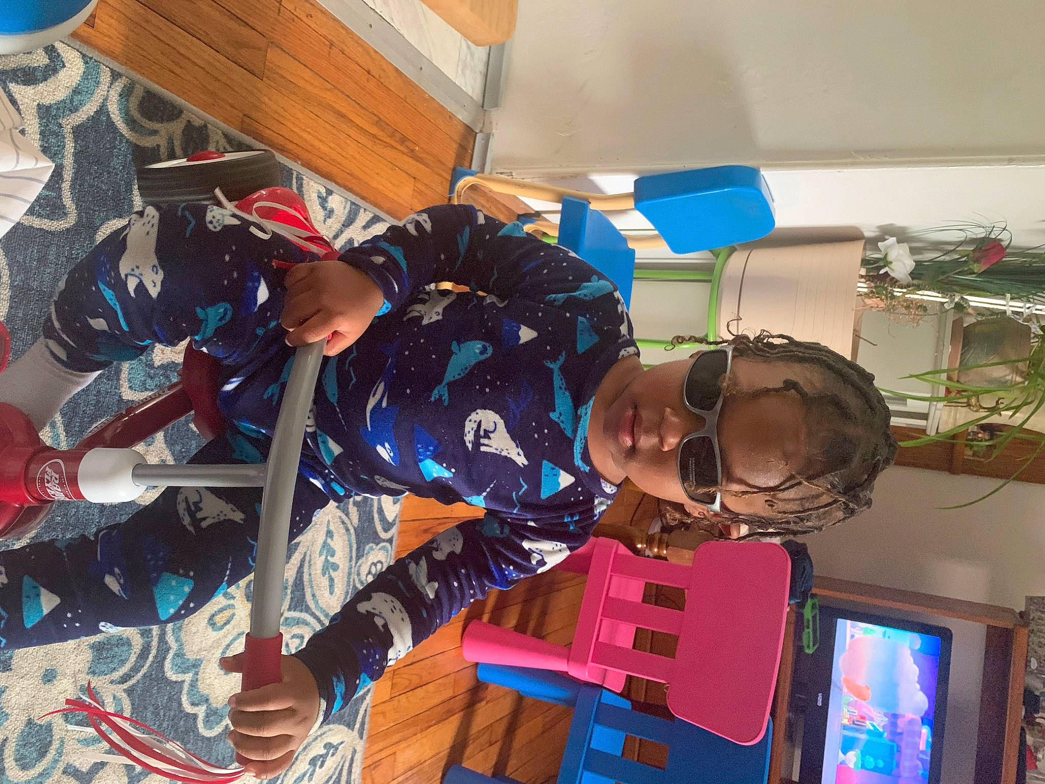 Apollo is registered to the contest to win money with this photo: display_device, electric_blue, eyewear, fun, hat, machine, person, personal_protective_equipment, recreation, room, space, television, toy, visual_arts