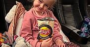 Giulia participe au concours pour gagner de l'argent avec cette photo : child, chip_bag, cinema_seat, coat, drink_bottle, family_outing, girl, happy, indoor, lays_chips, leisure, movie_theater, pink_clothing, plush_toy, portrait, sequin_skirt, smile, snack, stitch_bottle, stuffed_animal