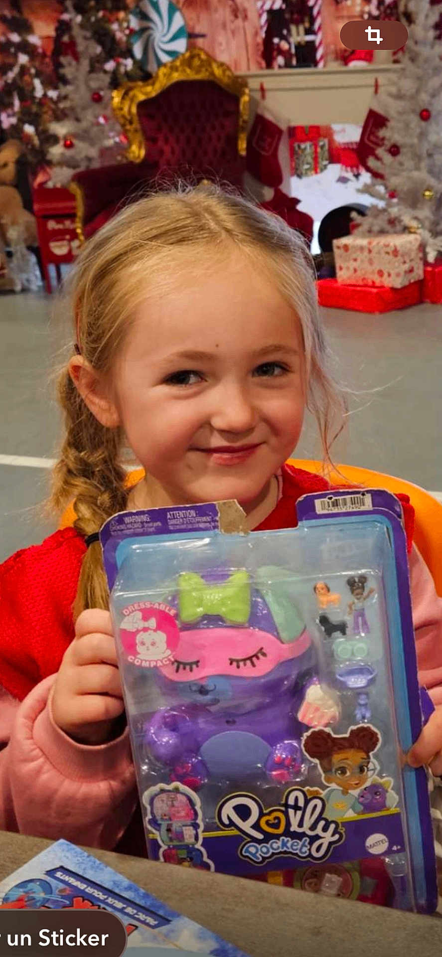 Giulia participe au concours pour gagner de l'argent avec cette photo : braid, chair, child, christmas_tree, cute, decorations, festive, gift, girl, gold, happy, holiday, indoor, packaging, playful, polly_pocket, present, red, smile, toy