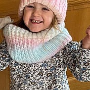 Giulia participe au concours pour gagner de l'argent avec cette photo : blue_pants, casual, child, cozy, cute, fashion, floral_shirt, happy, headwear, indoor, knit_hat, person, playful, portrait, scarf, smiling, tile_floor, warm_clothing, wooden_cabinet, young_child