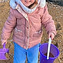 Giulia participe au concours pour gagner de l'argent avec cette photo : beach, black_boots, blue_pants, child, cold_weather, happy, hat, jacket, nature, outdoor, pebbles, person, play, portrait, purple_bucket, sand, shovel, smiling, toy, winter_clothing