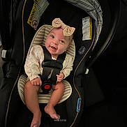 Swailyn joined the competition — help win amazing prizes! baby, car_seat, smile, headband, infant, straps, sitting, cute, indoors, child, person, seat, happy, clothing, face, safety, cute_baby, baby_girl, infant_seat, young_child