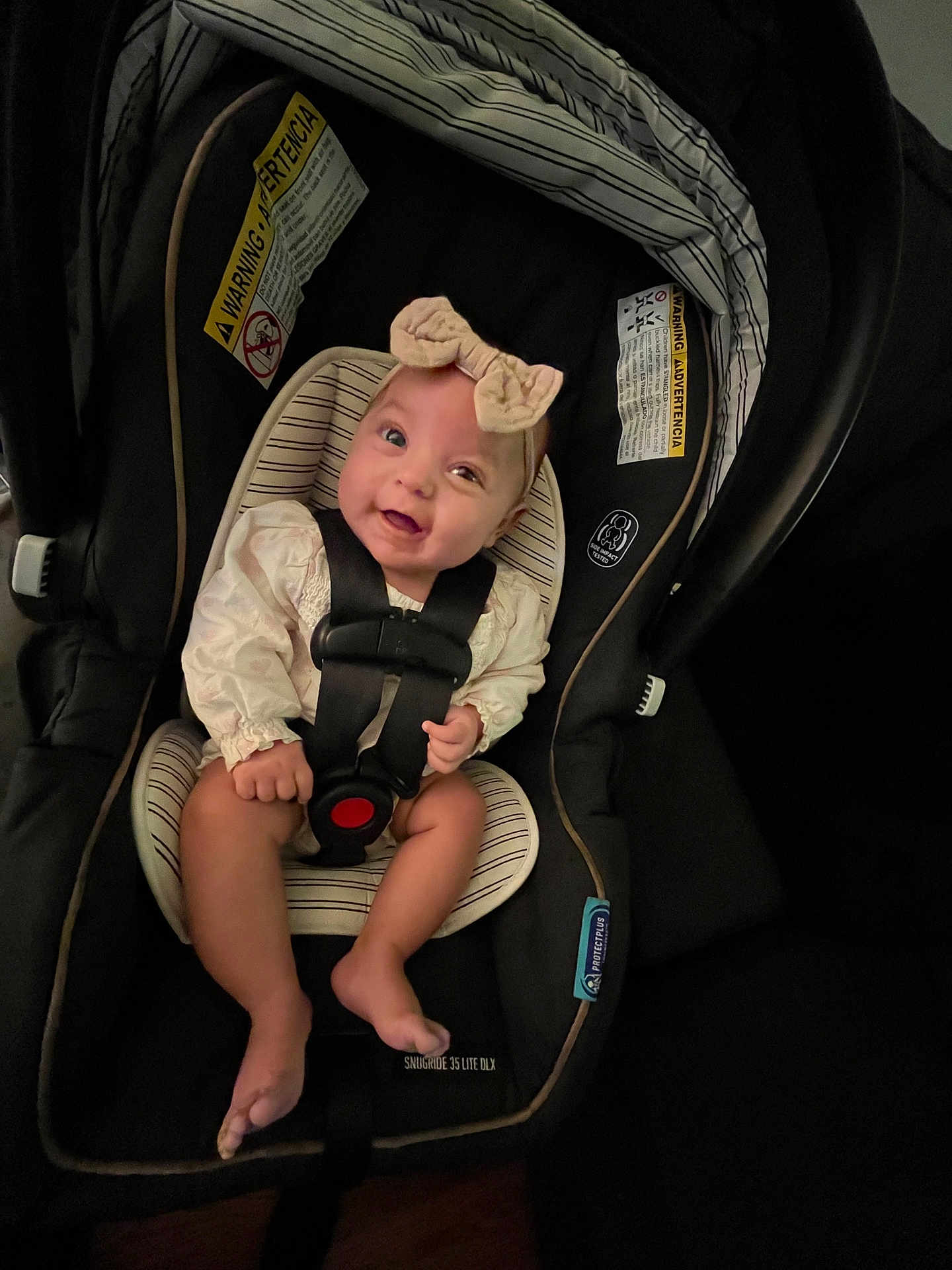 Swailyn joined the competition — help win amazing prizes! baby, car_seat, smile, headband, infant, straps, sitting, cute, indoors, child, person, seat, happy, clothing, face, safety, cute_baby, baby_girl, infant_seat, young_child