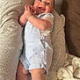 Victor participe au concours pour gagner de l'argent avec cette photo : baby, infant, smile, clothing, socks, pillow, blanket, couch, happy, face, person, indoor, child, overalls, hands, feet, laying, cozy, blue, white