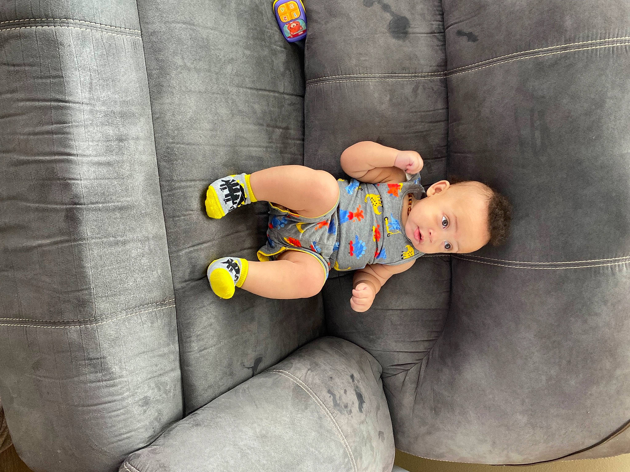 Jalen joined the competition — help win amazing prizes! baby, baby_toddler_clothing, child, comfort, couch, face, foot, fun, head, human_leg, jeans, knee, lap, linens, person, sitting, sleeve, sock, surprise, t_shirt